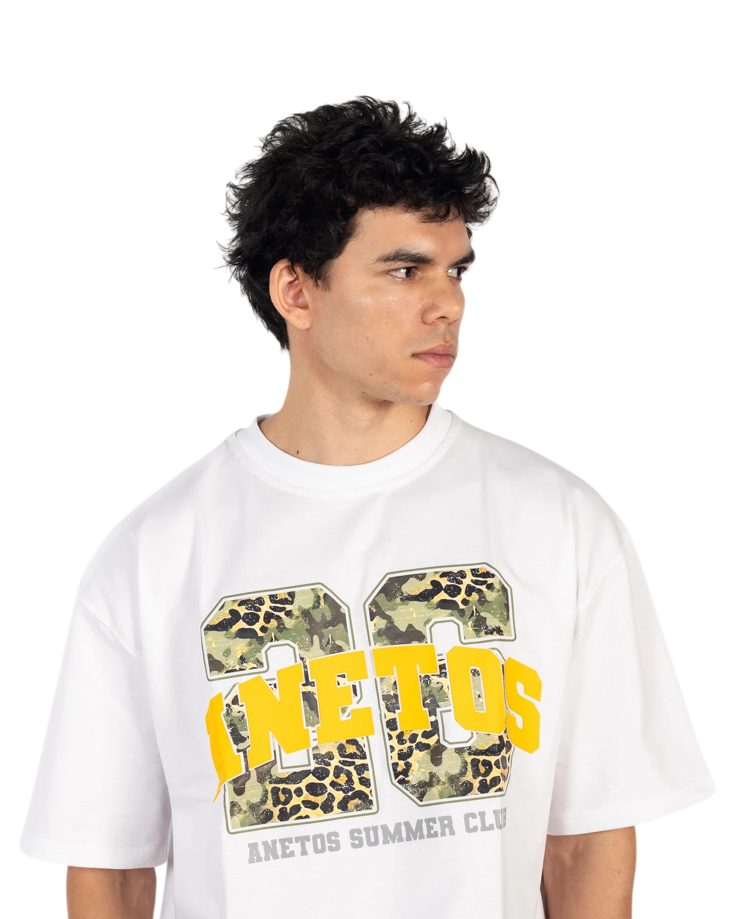 Anetos white cotton t-shirt with a graphic print featuring yellow text and camouflage/leopard pattern.