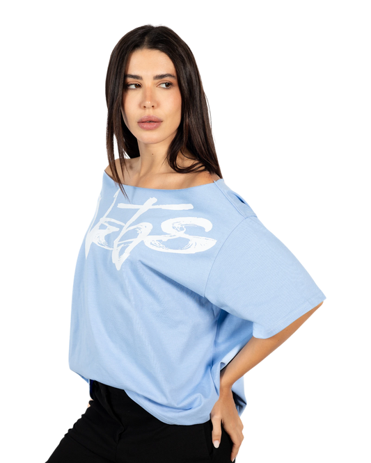 Anetos baby blue 100% Egyptian cotton off-shoulder top with white graphic print. Oversized fit.