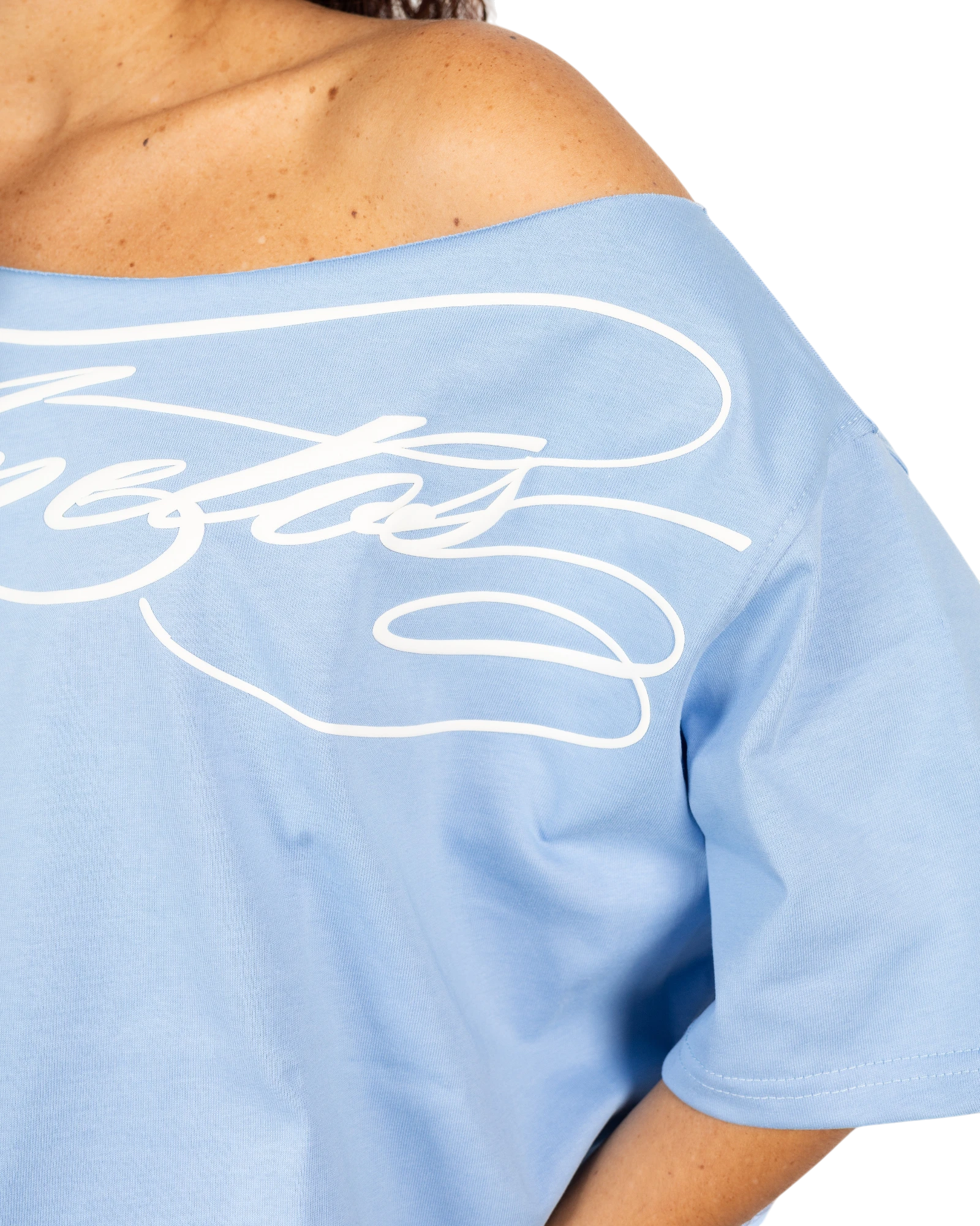 Anetos baby blue cotton off-shoulder top with white script logo detail. Relaxed fit, perfect for casual or dressy occasions.