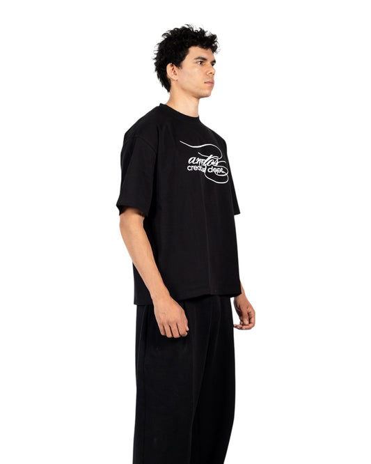 Anetos black cotton t-shirt with white 'creative dept.' graphic print on chest. Short sleeves, crew neck.