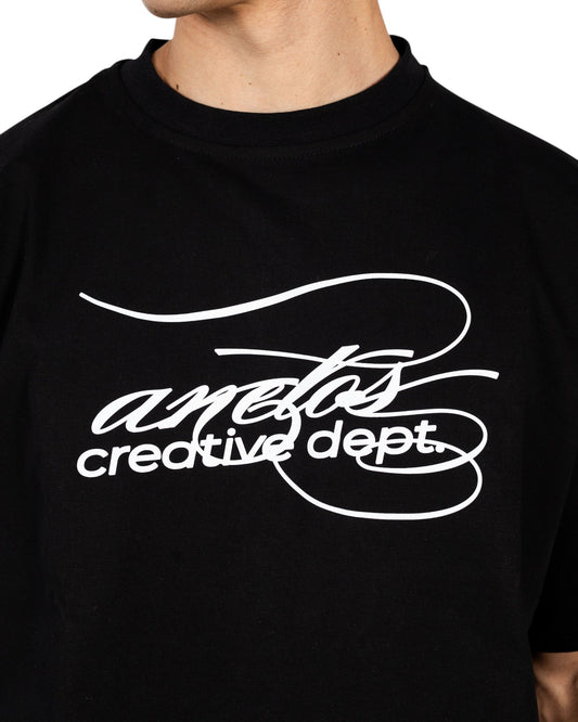 Anetos black cotton t-shirt with white 'creative dept.' graphic print. Crew neck, short sleeves.