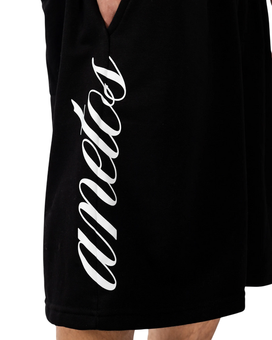 Anetos black double-waisted shorts with white script logo on the side.
