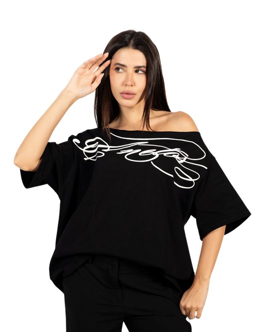 Anetos black cotton off-shoulder t-shirt with white graphic design and relaxed fit.