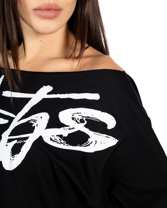 Anetos black 100% Egyptian cotton off-shoulder top with a white signature graphic print. Boxy, oversized fit.