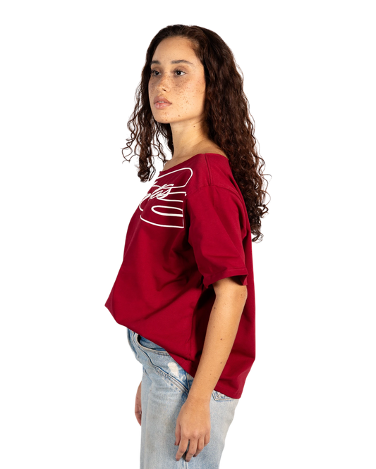 Anetos burgundy off-shoulder t-shirt with white graphic logo on the chest, made of cotton.