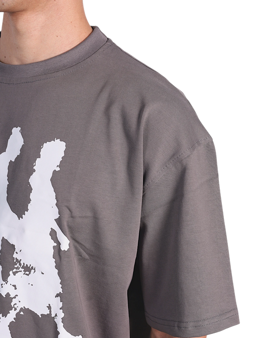 Anetos grey cotton t-shirt with white "From Cairo To The World" graphic print on the front, worn by a man.