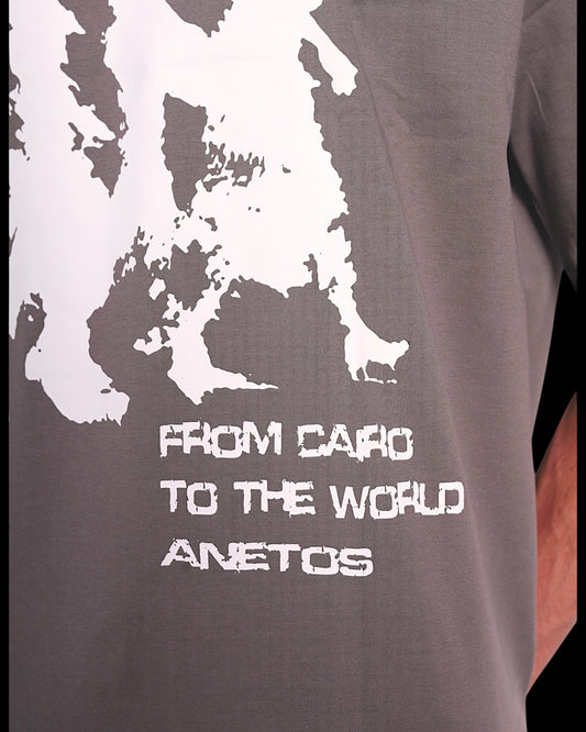 Anetos grey cotton t-shirt with white "From Cairo To The World" graphic print and brand name.