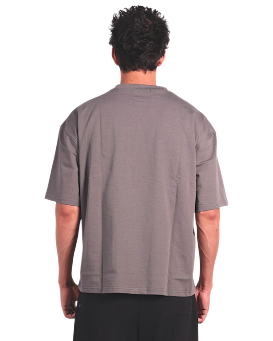 Anetos grey cotton t-shirt with short sleeves and a relaxed fit, paired with black trousers.