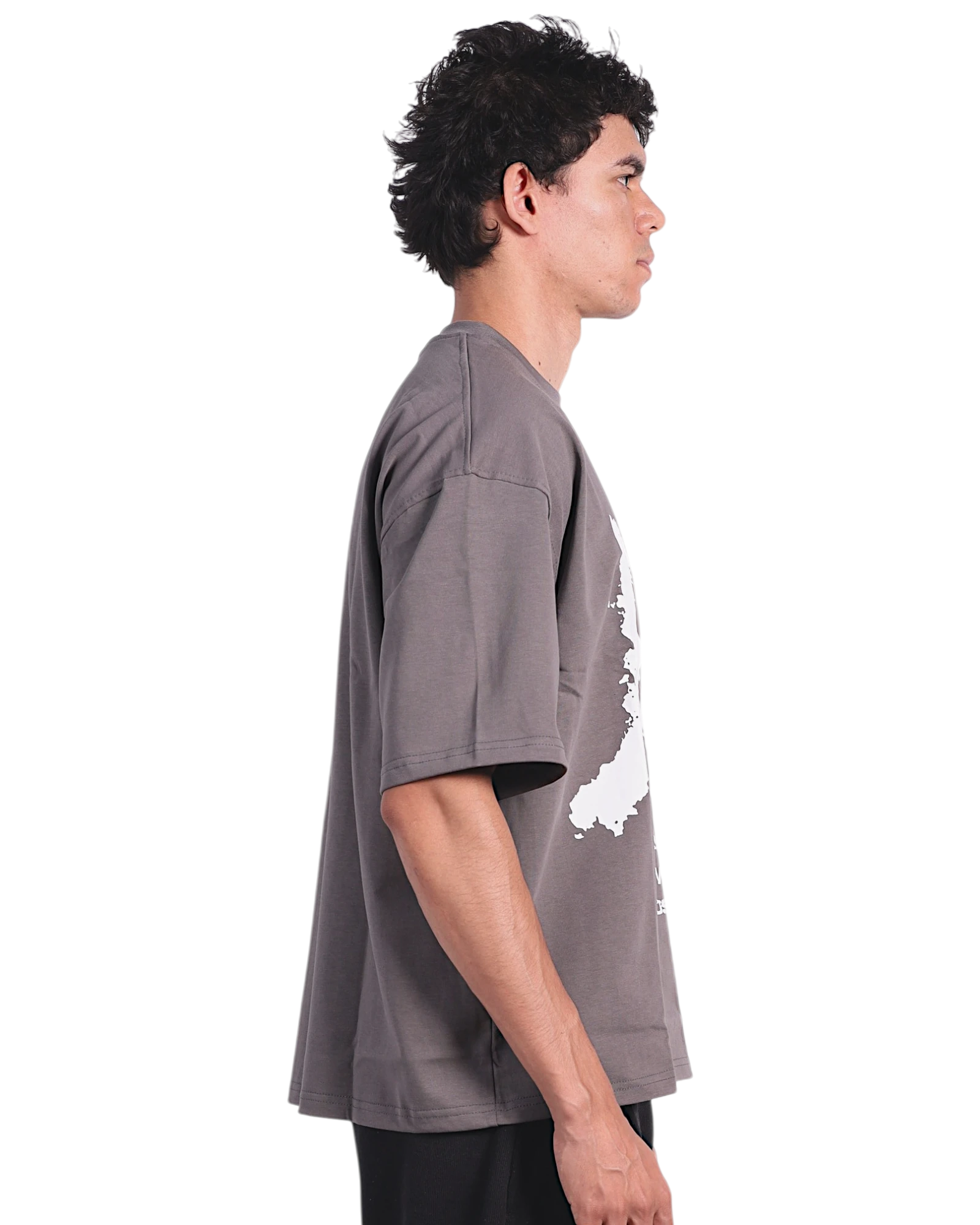 Anetos grey cotton t-shirt with a white graphic print, worn by a man with black pants and shoes.