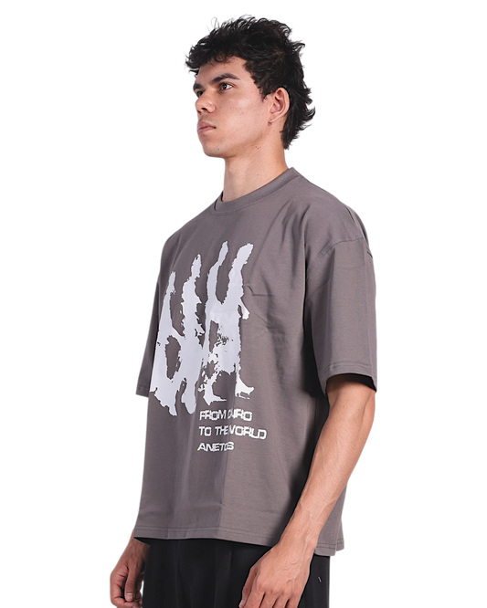 Anetos grey cotton t-shirt with 'From Cairo To The World' graphic print on chest, worn by a male model.