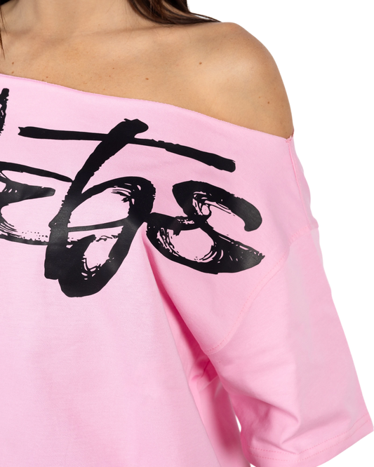 Anetos pink 100% Egyptian cotton off-shoulder top with black signature graphic print. Boxy, oversized fit.