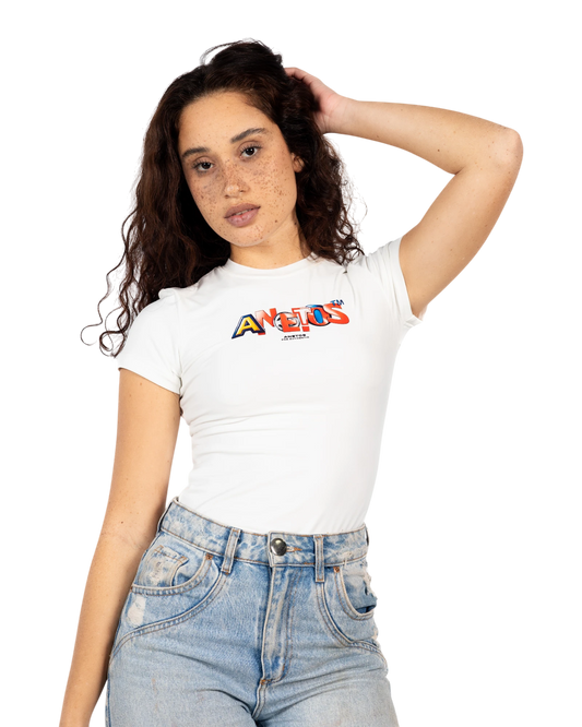 Anetos white short-sleeve top with colourful logo graphic, paired with light wash distressed denim jeans.
