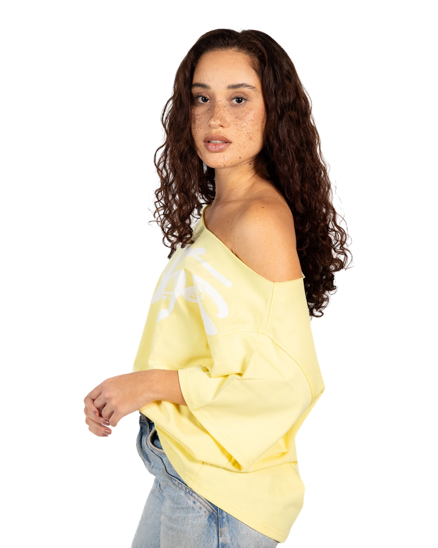 Anetos yellow 100% Egyptian cotton off-shoulder top with oversized fit and white graphic print.